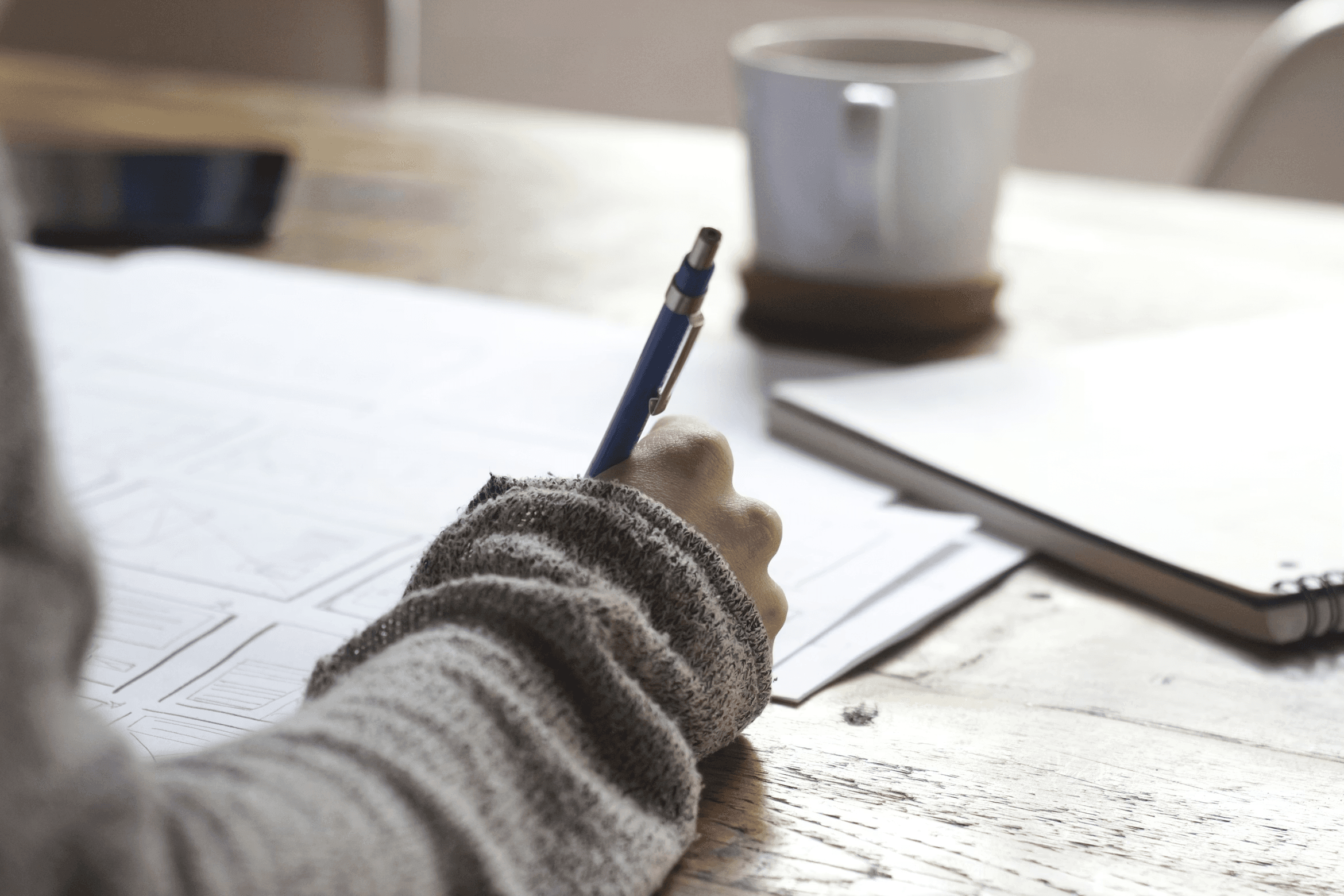 Student Completing Written Assessment at Desk